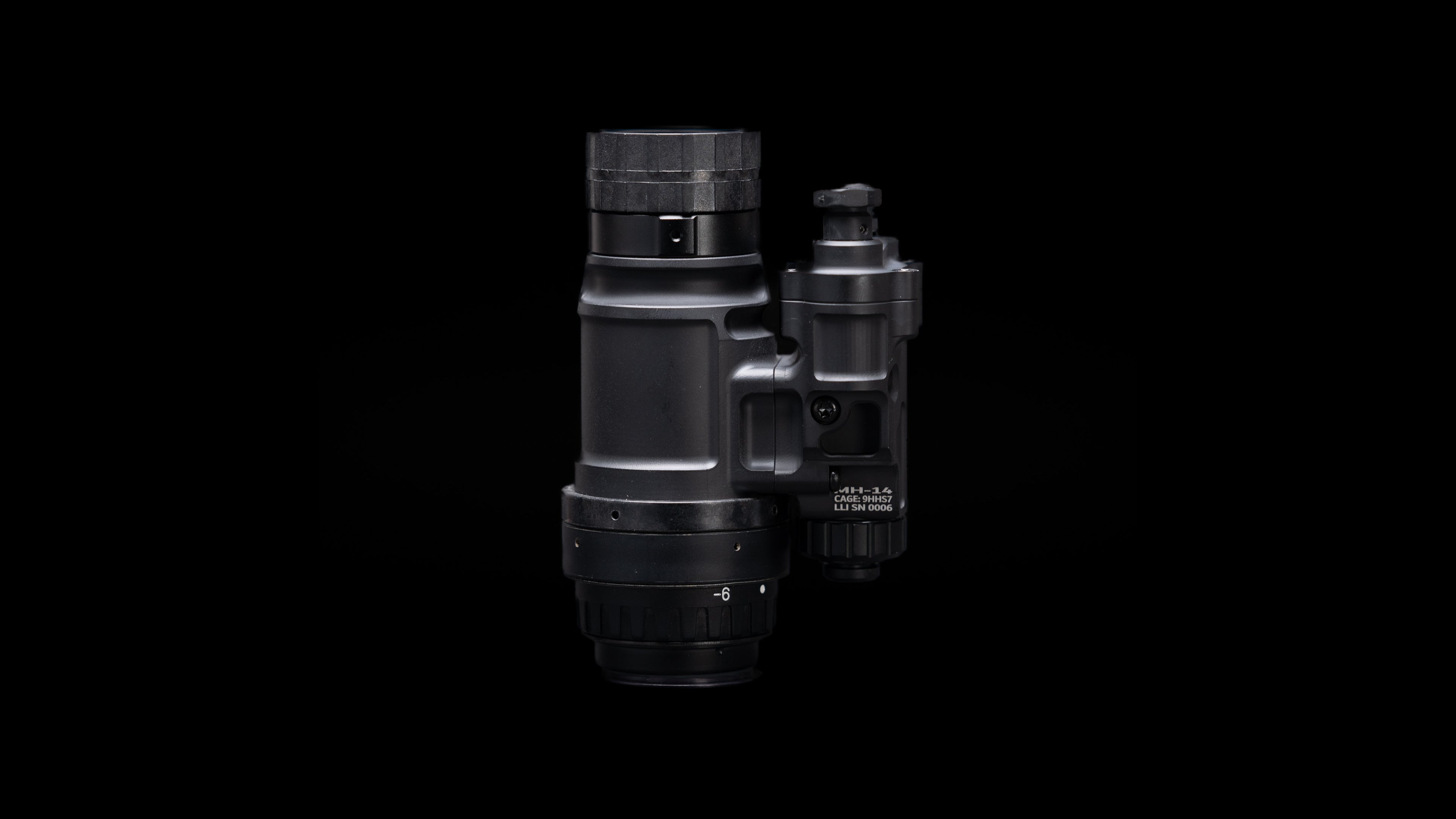 MH-14 USA-made magnesium monocular night vision goggle on black background